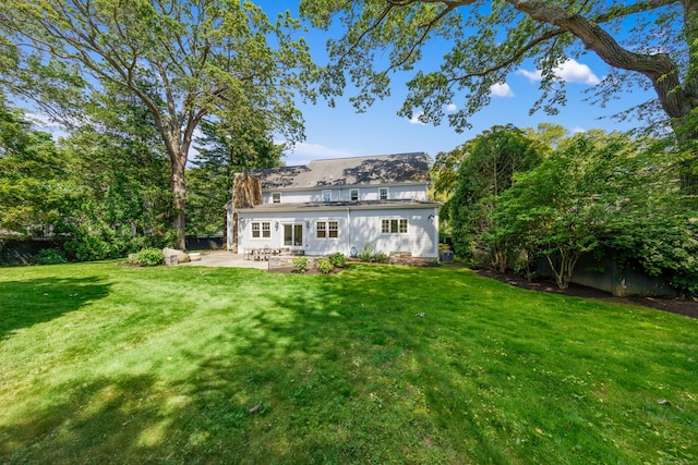31 Pleasant St, Darien, CT 06820 - rear view of property featuring a patio area and a lawn