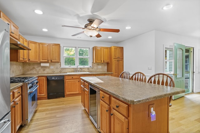 40A Mount Pleasant Rd, Newtown, CT 06470 - kitchen with appliances with stainless steel finishes, beverage cooler, a kitchen bar, a sink, and a center island