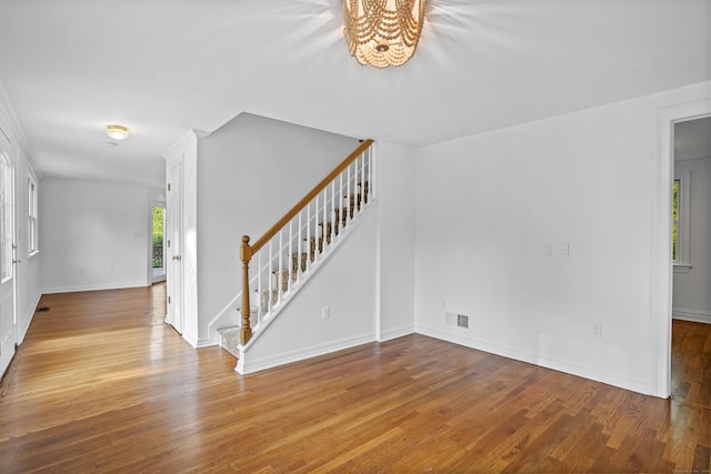 40A Mount Pleasant Rd, Newtown, CT 06470 - foyer featuring stairway, a chandelier, healthy amount of natural light, and wood finished floors