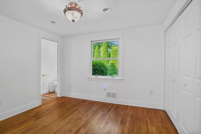 40A Mount Pleasant Rd, Newtown, CT 06470 - unfurnished bedroom with wood finished floors, baseboards, and a closet