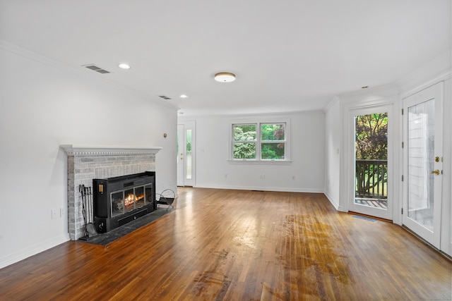 40A Mount Pleasant Rd, Newtown, CT 06470 - unfurnished living room with wood finished floors, baseboards, crown molding, a brick fireplace, and recessed lighting
