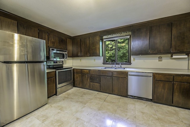 58 Wildwood Ln, Durham, CT 06422 - kitchen featuring appliances with stainless steel finishes, a sink, light countertops, and dark brown cabinets