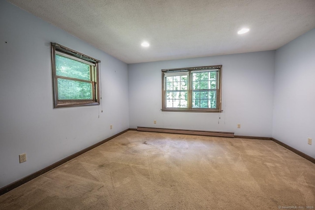 58 Wildwood Ln, Durham, CT 06422 - unfurnished room featuring a baseboard heating unit, carpet floors, baseboards, recessed lighting, and a textured ceiling