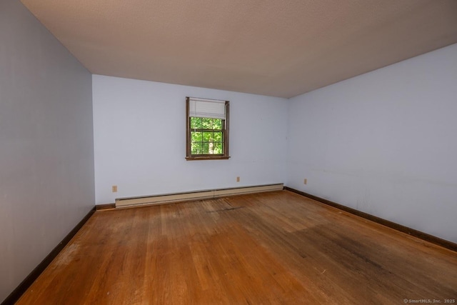 58 Wildwood Ln, Durham, CT 06422 - empty room featuring a baseboard radiator, wood finished floors, and baseboards