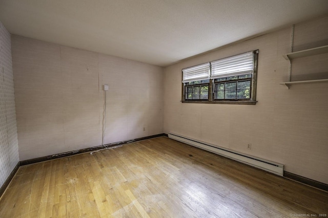 58 Wildwood Ln, Durham, CT 06422 - unfurnished room featuring a baseboard radiator and wood finished floors