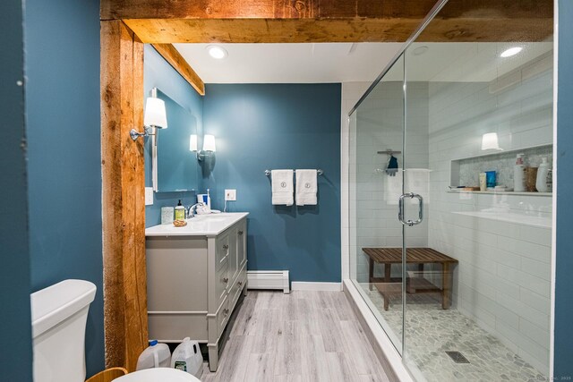 1900 Home Rd, Great Barrington, MA 01230 - bathroom featuring toilet, vanity, baseboard heating, a stall shower, and wood finished floors