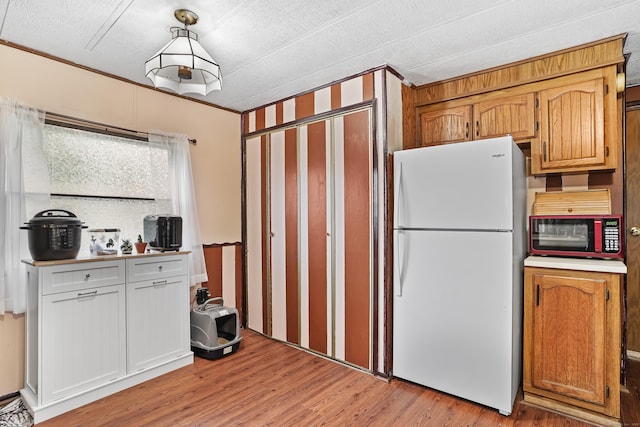 70 Woodland Park, Shelton, CT 06484 - kitchen featuring white appliances, light wood finished floors, and light countertops