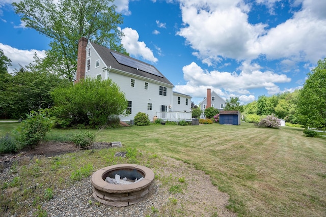 2 Acorn Dr, East Haddam, CT 06423 - view of grassy yard with an outdoor fire pit and a wooden deck