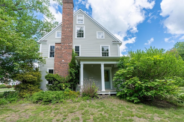 2 Acorn Dr, East Haddam, CT 06423 - rear view of property featuring a porch and a chimney