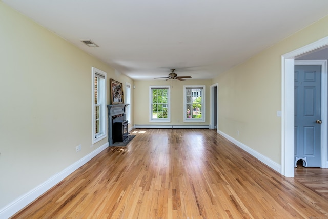 2 Acorn Dr, East Haddam, CT 06423 - unfurnished living room featuring a fireplace, light wood-style flooring, baseboards, and a ceiling fan