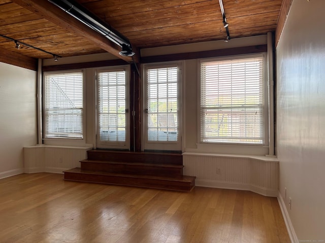 68 Thermos Ave Unit 410E, Norwich, CT 06360 - spare room with rail lighting, light wood-type flooring, and wooden ceiling