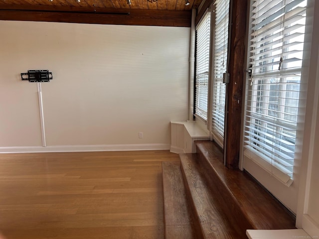 68 Thermos Ave Unit 410E, Norwich, CT 06360 - empty room with plenty of natural light, wood finished floors, and wooden ceiling