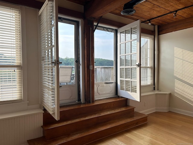68 Thermos Ave Unit 410E, Norwich, CT 06360 - unfurnished sunroom with track lighting, radiator heating unit, and french doors
