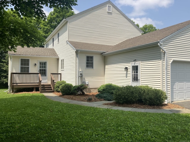 116 Taylor Rd, New Milford, CT 06776 - back of property with an attached garage, a lawn, a deck, and roof with shingles