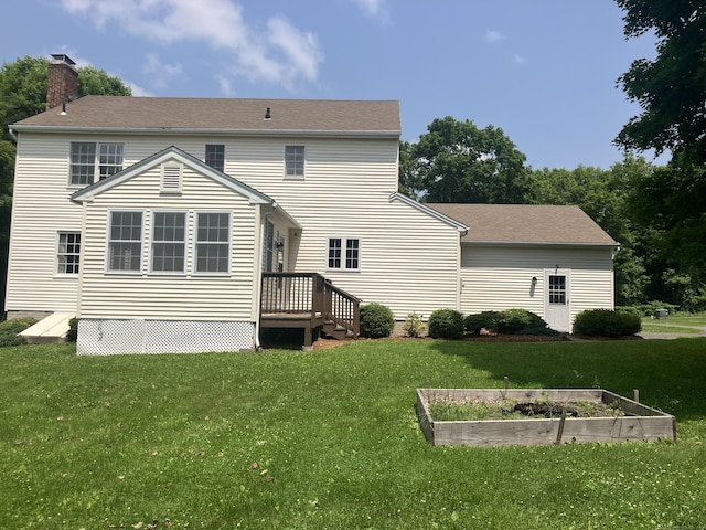 116 Taylor Rd, New Milford, CT 06776 - rear view of property featuring a vegetable garden, a chimney, a yard, and a deck