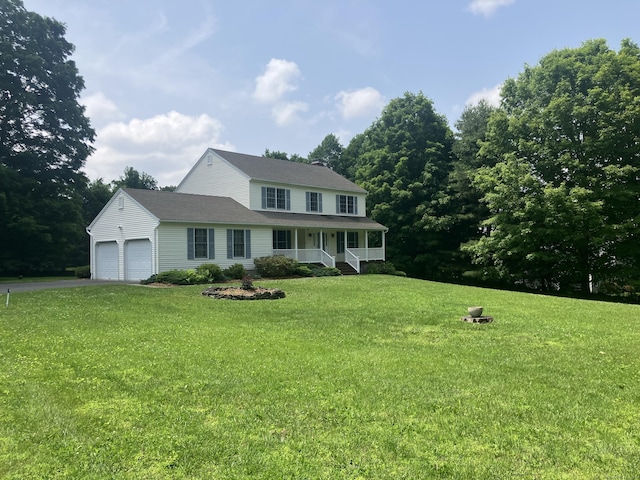 116 Taylor Rd, New Milford, CT 06776 - view of front of property with covered porch, asphalt driveway, a front yard, and a garage