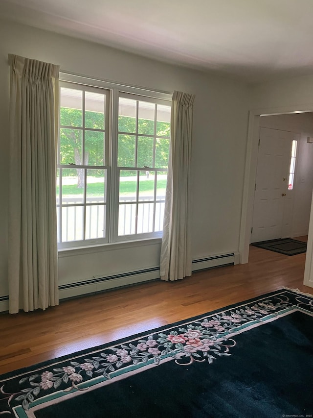 116 Taylor Rd, New Milford, CT 06776 - foyer entrance with light wood-type flooring and a baseboard heating unit