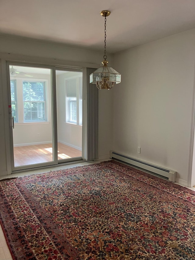 116 Taylor Rd, New Milford, CT 06776 - spare room with a chandelier and a baseboard heating unit