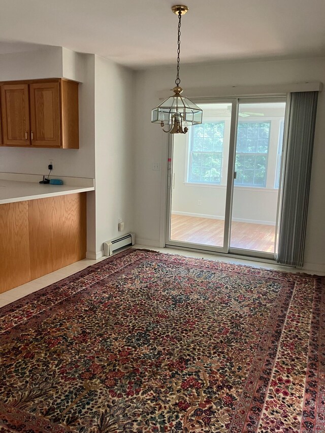 116 Taylor Rd, New Milford, CT 06776 - unfurnished dining area with a baseboard radiator and a chandelier