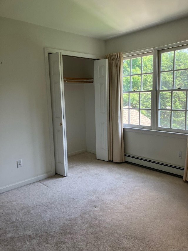 116 Taylor Rd, New Milford, CT 06776 - unfurnished bedroom featuring baseboard heating, light carpet, and a closet
