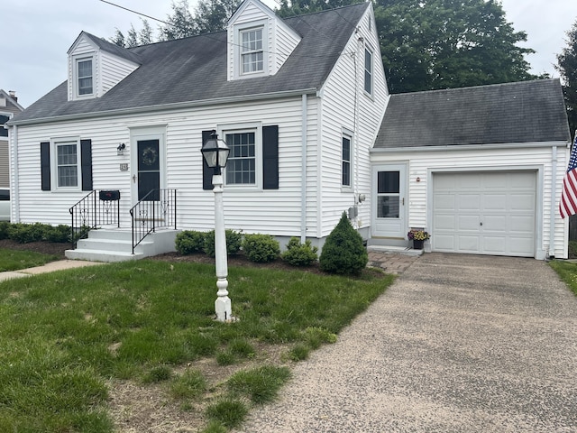 24 Westview St, Hamden, CT 06514 - cape cod house with an attached garage, a front yard, asphalt driveway, and roof with shingles