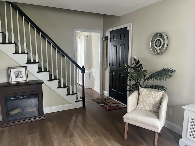 24 Westview St, Hamden, CT 06514 - entryway featuring wood finished floors, stairway, and baseboards