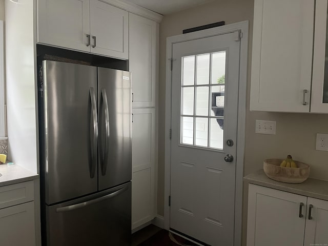 24 Westview St, Hamden, CT 06514 - kitchen featuring freestanding refrigerator, light countertops, and white cabinetry