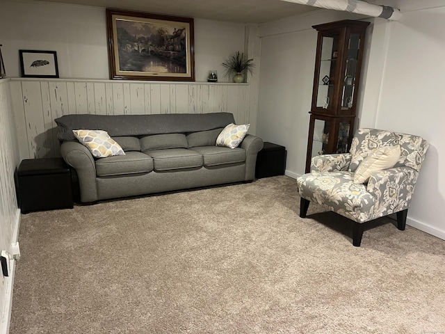 24 Westview St, Hamden, CT 06514 - living area with carpet flooring, wood walls, and baseboards