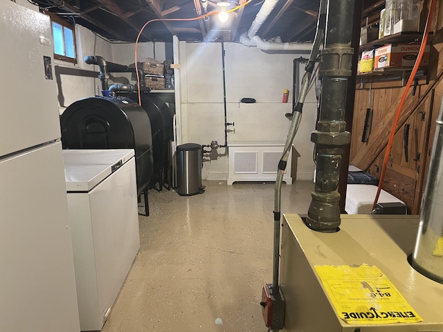 24 Westview St, Hamden, CT 06514 - basement with freestanding refrigerator, washer / clothes dryer, and oil tank