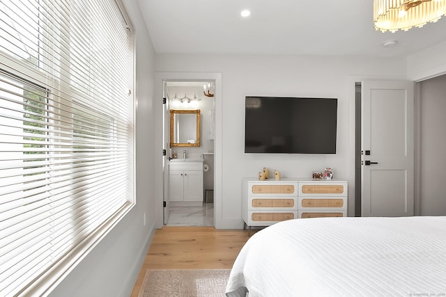 1 Howard Ave Unit C2, Norwalk, CT 06855 - bedroom featuring light wood finished floors, ensuite bath, baseboards, and recessed lighting