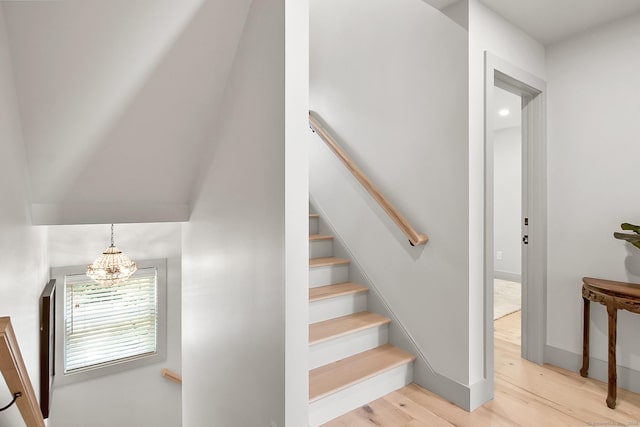 1 Howard Ave Unit C2, Norwalk, CT 06855 - stairway with wood finished floors, a chandelier, and baseboards