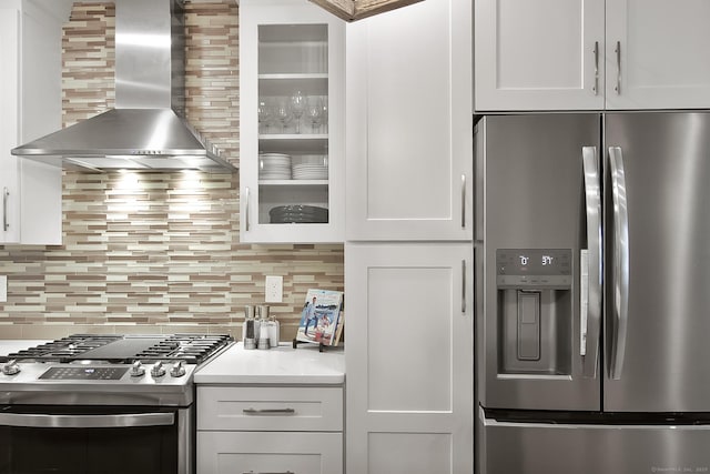 1 Howard Ave Unit C2, Norwalk, CT 06855 - kitchen with appliances with stainless steel finishes, wall chimney exhaust hood, decorative backsplash, and white cabinetry