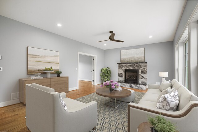 14 Fiddlehead Pl, Suffield, CT 06078 - living room featuring light wood-style floors, ceiling fan, baseboards, a high end fireplace, and recessed lighting