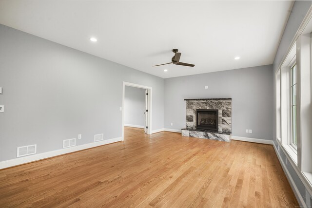 14 Fiddlehead Pl, Suffield, CT 06078 - unfurnished living room featuring ceiling fan, healthy amount of natural light, light wood-style flooring, a fireplace, and recessed lighting