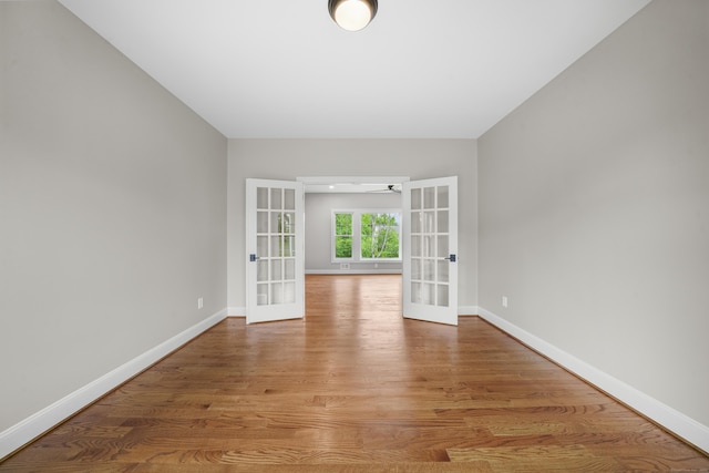 14 Fiddlehead Pl, Suffield, CT 06078 - empty room with french doors, baseboards, light wood-type flooring, and ceiling fan
