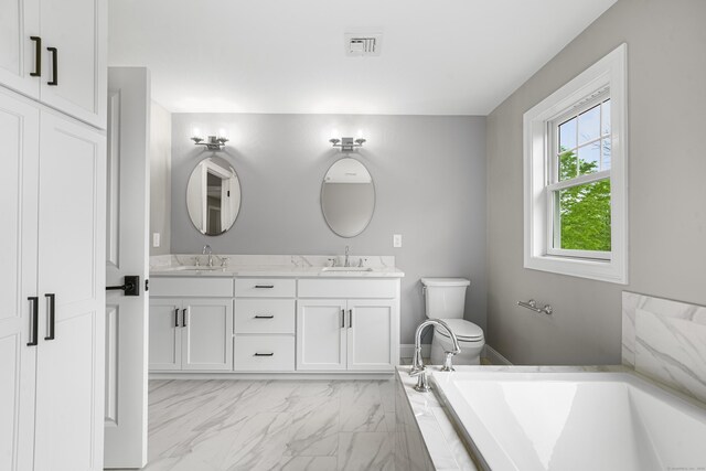 14 Fiddlehead Pl, Suffield, CT 06078 - bathroom with double vanity, marble look tiles, a garden tub, and toilet