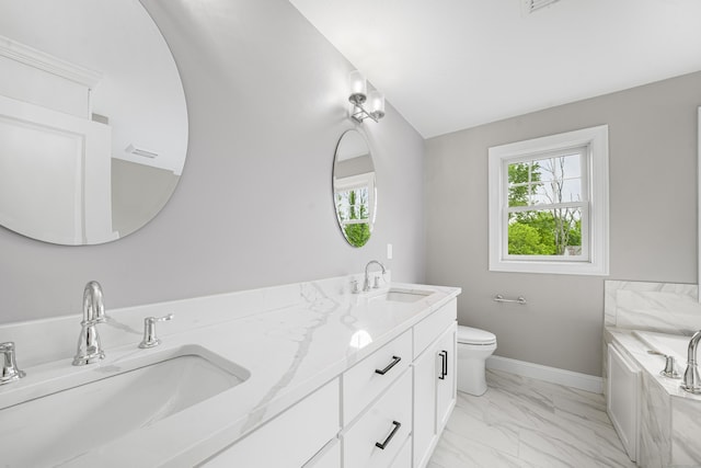 14 Fiddlehead Pl, Suffield, CT 06078 - bathroom with marble look tiles, double vanity, baseboards, a garden tub, and toilet