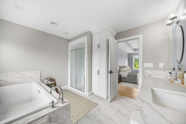 14 Fiddlehead Pl, Suffield, CT 06078 - bathroom featuring a bath, marble finish flooring, double vanity, a shower stall, and baseboards