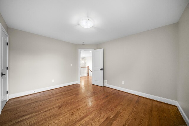 14 Fiddlehead Pl, Suffield, CT 06078 - empty room featuring baseboards and wood finished floors