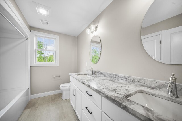 14 Fiddlehead Pl, Suffield, CT 06078 - bathroom with double vanity, plenty of natural light, toilet, and baseboards