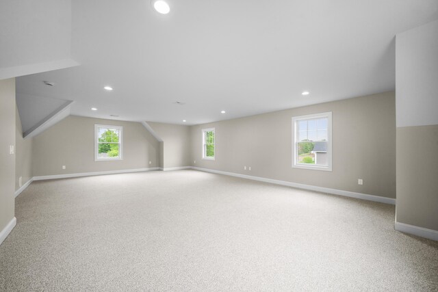 14 Fiddlehead Pl, Suffield, CT 06078 - additional living space with carpet floors, baseboards, recessed lighting, and lofted ceiling