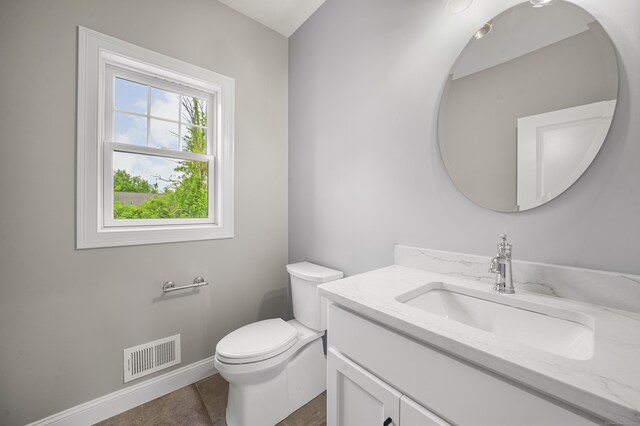 14 Fiddlehead Pl, Suffield, CT 06078 - half bathroom featuring vanity, toilet, baseboards, and tile patterned flooring
