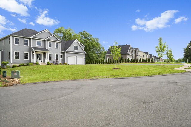 14 Fiddlehead Pl, Suffield, CT 06078 - view of front of house with a garage, a front lawn, and driveway