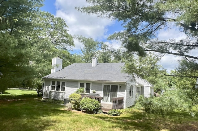 20 Canterbury Rd Unit 20, Hamden, CT 06514 - back of house with a chimney, a yard, a deck, and roof with shingles