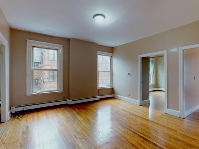 24 Townley St, Hartford, CT 06105 - empty room featuring light wood-type flooring, baseboard heating, and baseboards