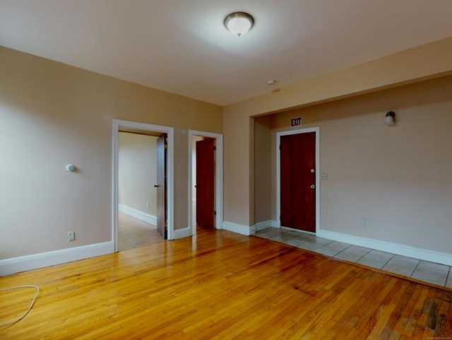 24 Townley St, Hartford, CT 06105 - empty room with light wood-style flooring and baseboards