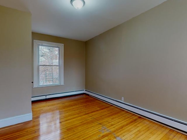 24 Townley St, Hartford, CT 06105 - spare room featuring a baseboard heating unit, light wood-type flooring, and baseboards