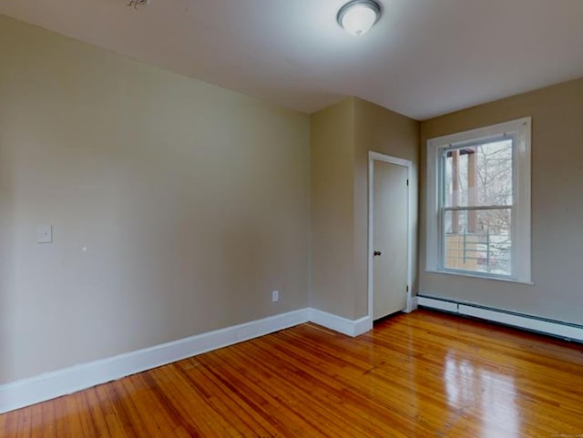24 Townley St, Hartford, CT 06105 - unfurnished room with baseboards, light wood finished floors, and baseboard heating