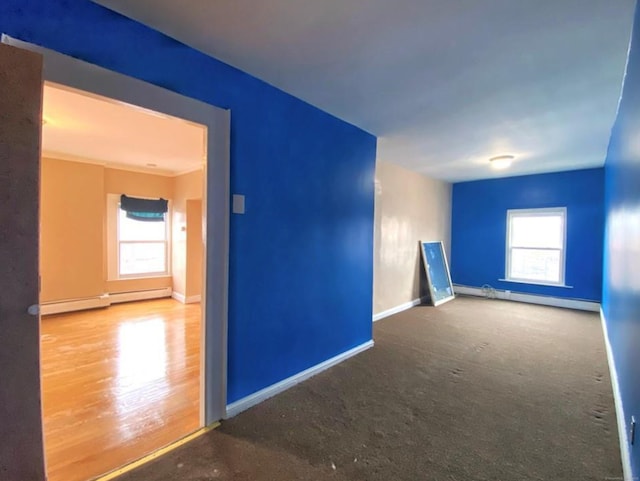 24 Townley St, Hartford, CT 06105 - carpeted empty room featuring a baseboard heating unit and baseboards