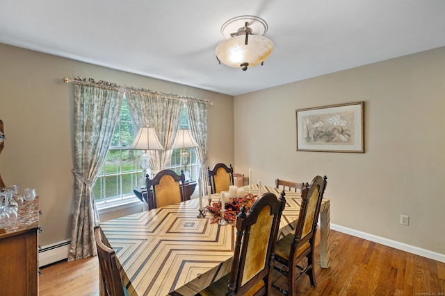 47 Trillium Cir, Fairfield, CT 06824 - dining area featuring a baseboard heating unit, light wood-style floors, and baseboards